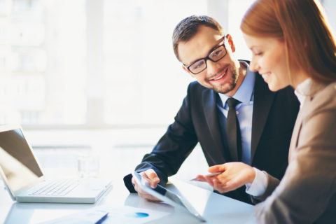 Man and woman discussing business insurance in