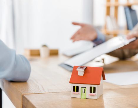 An Agent helping a client with a Homeowners Insurance Policy